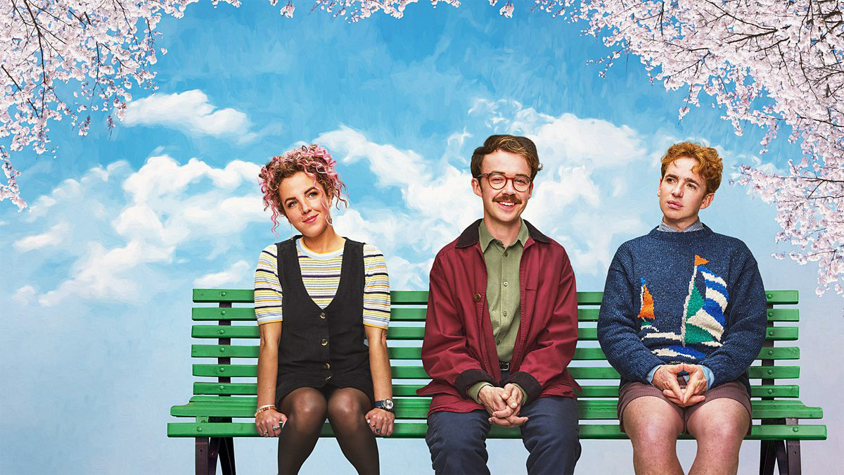 Cartell promocional de la sèrie leonard and HUngry Paul amb els tres protagonistes asseguts a un banc del parc.